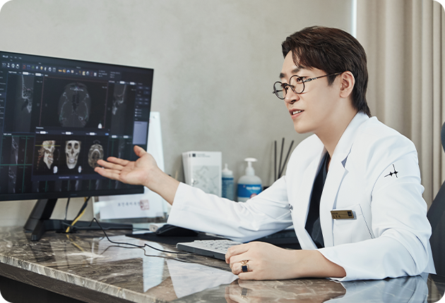 Precise ultrasound examination — a doctor explaining on a monitor