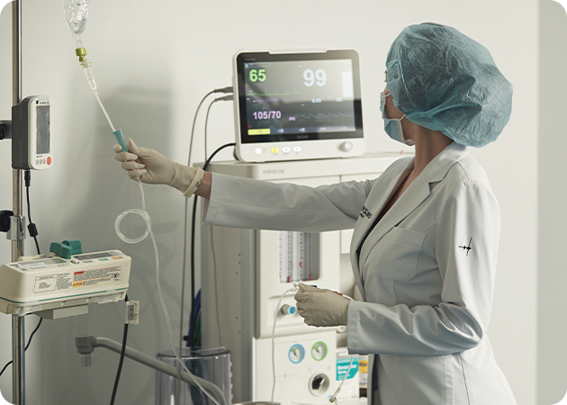 An anesthesiologist monitoring a patient's condition